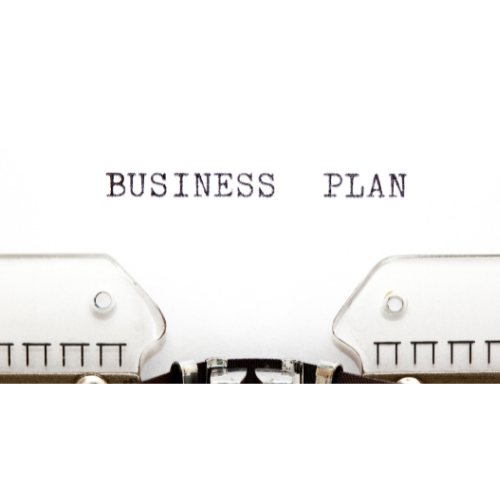 A vintage typrewriter with the words tyoed - "business plan"