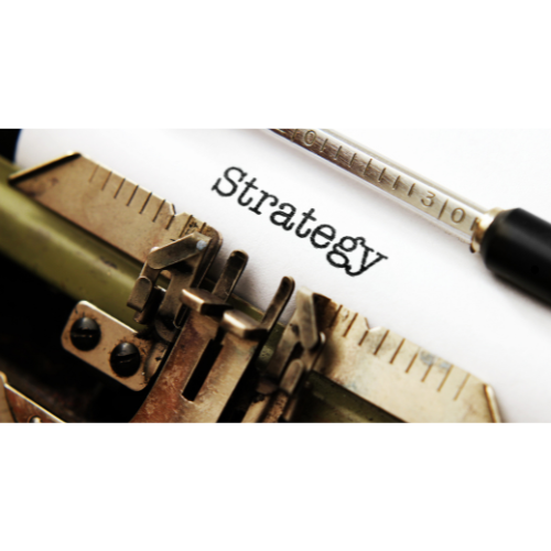 A vintage typrewriter with the word strategy written