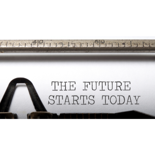 A vintage typrewriter with the words typed - The Future Starts Today